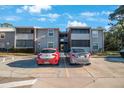 Apartment complex with designated accessible parking spots on a sunny day at 1400 Gandy N Blvd # 715, St Petersburg, FL 33702