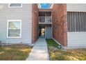 Walkway featuring a brick section and white railing for the second-floor units at 1400 Gandy N Blvd # 715, St Petersburg, FL 33702