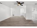 Bright and airy living room with vinyl wood flooring and ceiling fan at 14915 Gentilly Pl, Tampa, FL 33624