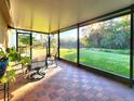 Relaxing screened porch overlooking a tranquil lake at 30923 Burleigh Dr, Wesley Chapel, FL 33543