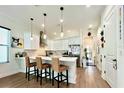 Modern kitchen with white cabinets, quartz countertops, and stainless steel appliances at 4120 N Nebraska Ave, Tampa, FL 33603