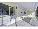 Covered patio with screened enclosure and access to home at 4961 Britni Way, Zephyrhills, FL 33541