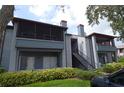 Two-story building with gray siding and balconies at 10265 Gandy N Blvd # 705, St Petersburg, FL 33702