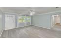 Spacious living room with light gray walls and vinyl wood flooring at 106 S Nimbus Ave, Clearwater, FL 33765