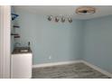 Small wet bar with granite countertop and white cabinets at 1644 24Th N Ave, St Petersburg, FL 33713