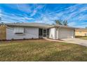 Recently updated home exterior with fresh paint and landscaping at 500 Randolph Rd, Venice, FL 34293