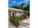 Well-maintained house with attractive landscaping and a welcoming entrance at 1016 Mandalay Ave, Clearwater Beach, FL 33767