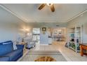 Bright living room with comfy seating, large TV, and ocean views at 18320 Gulf Blvd # 303, Redington Shores, FL 33708