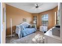 Cozy bedroom featuring a daybed, workspace, and ample natural light at 225 Mystic Falls Dr, Apollo Beach, FL 33572