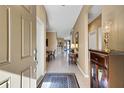 Bright and airy entryway with tile flooring and views into the living area at 225 Mystic Falls Dr, Apollo Beach, FL 33572