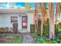 Inviting entryway with a walkway and lush greenery at 2465 Northside Dr # 1808, Clearwater, FL 33761