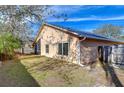 Side view of the backyard featuring a fenced yard and well-maintained lawn at 2529 Clareside Dr, Valrico, FL 33596