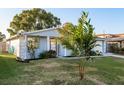 Cute one-story house with a welcoming front yard and lush landscaping at 2713 Apia Pl, Holiday, FL 34691