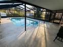 Inviting screened pool with ample deck space for lounging at 39093 Citadel Cir, Zephyrhills, FL 33542