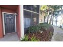 Exterior of a condo with screened lanai, highlighting the waterfront living and outdoor access at 5764 Baywater Dr # 5764, Tampa, FL 33615