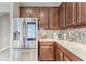 Modern kitchen with stainless steel appliances and tile backsplash at 6445 Tideline Dr, Apollo Beach, FL 33572