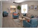 Spacious living room with light flooring and comfy seating at 8010 N 11Th St, Tampa, FL 33604