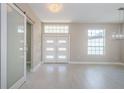 Bright entryway with double front doors and a sliding barn door at 16117 Medrick Rd, Brooksville, FL 34614