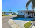 Mobile home community with paved roads and palm trees at 34462 Palm N Dr, Pinellas Park, FL 33781