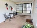 Relaxing screened porch with outdoor seating, perfect for enjoying the Florida weather at 5835 Little River Dr, Tampa, FL 33615