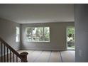 Bright living room with ample natural light, perfect for comfortable living and entertaining at 1530 W River Shore Way, Tampa, FL 33603