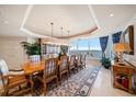 Elegant dining room features a large table, scenic views, and stylish decor at 3 Seaside Ln # 601, Belleair, FL 33756