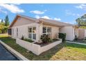Side view of a single story home showcasing its neat landscaping at 3954 Sailmaker Ln, Holiday, FL 34691