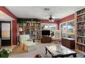 Spacious living room with built-in bookshelves and comfortable seating at 3954 Sailmaker Ln, Holiday, FL 34691