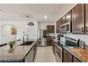Modern kitchen with stainless steel appliances and granite countertops at 5808 Calla Lilly Dr, Sarasota, FL 34232