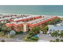 Aerial view of condo complex near beach, showing building and parking at 6006 Gulf Dr # 207, Holmes Beach, FL 34217