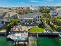 Stunning waterfront home with a private dock, pool, and lush landscaping at 123 8Th E St, Tierra Verde, FL 33715