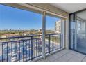 View from condo balcony overlooking parking lot and partial ocean view at 6372 Palma Del Mar S Blvd # 505, St Petersburg, FL 33715