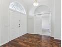 Bright foyer with double doors and wood-look flooring at 17926 Sparrows Nest Dr, Lutz, FL 33558