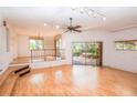 Spacious living area with hardwood floors and sliding doors at 5400 Bates St, Seminole, FL 33772