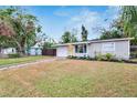 Charming single-story home features an attached garage, well-maintained lawn, and inviting front entrance at 6524 14Th N St, St Petersburg, FL 33702