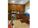 Spacious kitchen with wood cabinets and stainless steel appliances at 6658 Williams Rd, Seffner, FL 33584
