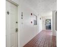 Clean condo hallway with tile floors at 7871 Sailboat Key S Blvd # 106, South Pasadena, FL 33707