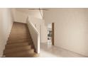 Open foyer with wood stairs, neutral walls, and view to the living area at 1260 Wellington Dr, Clearwater, FL 33764