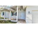 Welcoming front porch with stylish accents, providing a charming entrance to the home at 1722 St Croix Dr, Clearwater, FL 33759