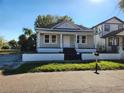 Charming bungalow with front porch, freshly painted exterior, and landscaped lawn at 2120 W Beach St, Tampa, FL 33607