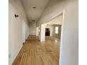 Long hallway with hardwood floors leading to various rooms at 2120 W Beach St, Tampa, FL 33607