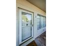 Close-up of the front door with storm door at 2379 Finlandia Ln # 3, Clearwater, FL 33763