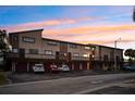 View of the building's exterior at sunset at 6321 Newtown Cir # 21B4, Tampa, FL 33615
