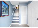 Foyer with stairway, tiled floor, and built-in storage at 637 Pinellas Bayway S # 111, St Petersburg, FL 33715