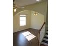 Bright living room with hardwood floors and lots of natural light at 7423 Pulteney Dr, Zephyrhills, FL 33545