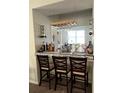 Bar area with marble countertop and a built-in wine rack at 10319 Boyette Creek Blvd, Riverview, FL 33569