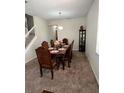 Formal dining room with a beautiful table set for six at 10319 Boyette Creek Blvd, Riverview, FL 33569