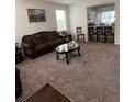 Living room features a bar area, and is carpeted for added comfort at 10319 Boyette Creek Blvd, Riverview, FL 33569