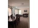 Inviting living room with a dining area, plush seating, and bright windows at 10319 Boyette Creek Blvd, Riverview, FL 33569