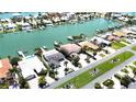 High-angle view of the home nestled amongst lush greenery, with waterfront access at 11300 7Th E St, Treasure Island, FL 33706